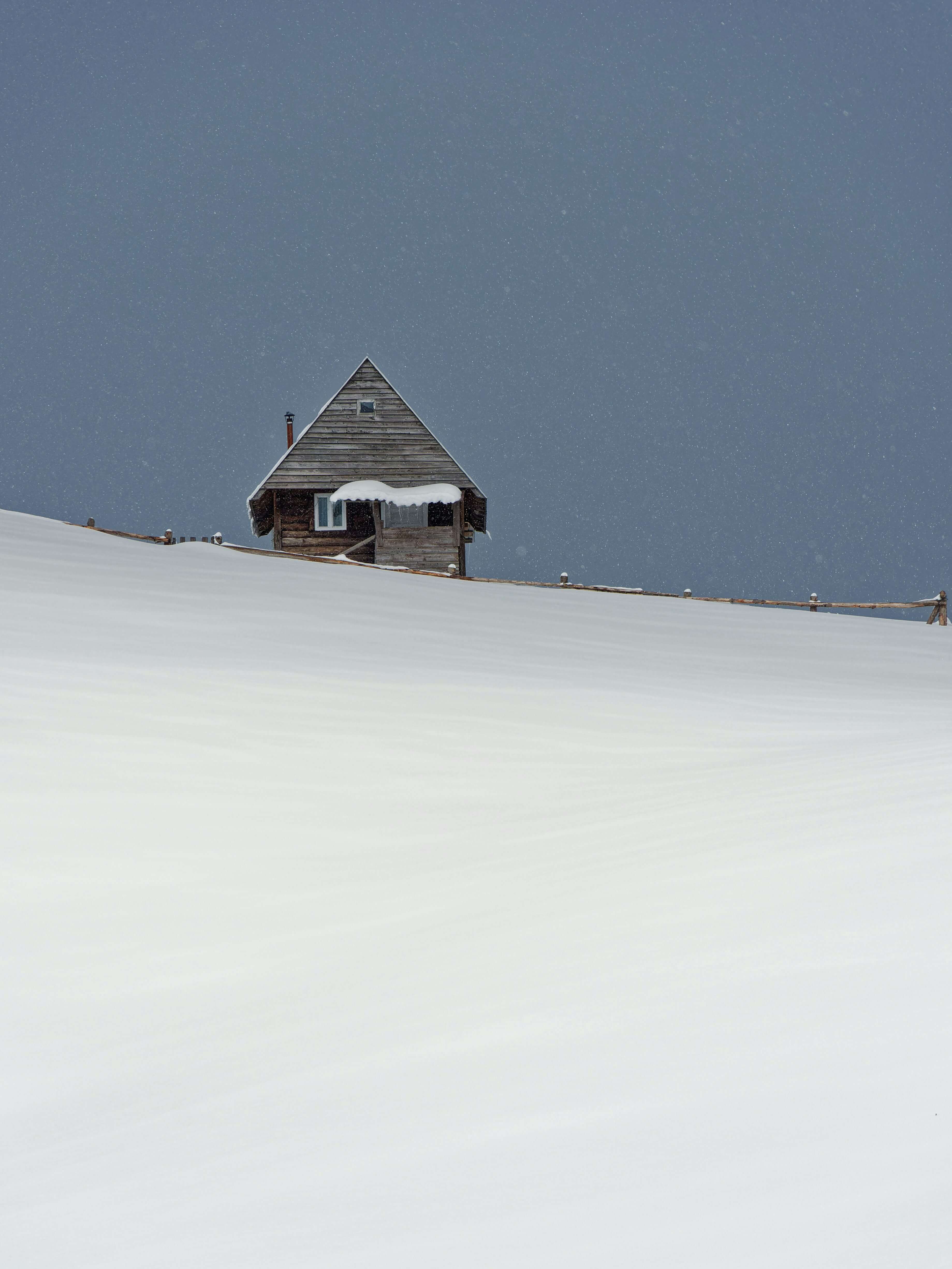 Snow-covered house in winter - winter home maintenance
